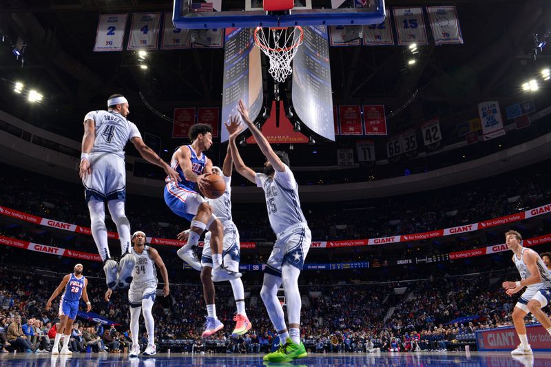 PHILADELPHIA, PA - DECEMBER 4: Jared McCain #20 of the Philadelphia 76ers passes the ball during the game against the Orlando Magic on December 4, 2024 at the Wells Fargo Center in Philadelphia, Pennsylvania NOTE TO USER: User expressly acknowledges and agrees that, by downloading and/or using this Photograph, user is consenting to the terms and conditions of the Getty Images License Agreement. Mandatory Copyright Notice: Copyright 2024 NBAE (Photo by Jesse D. Garrabrant/NBAE via Getty Images)