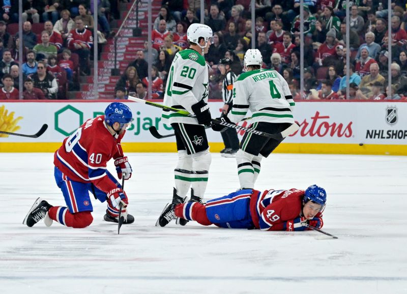 Feb 10, 2024; Montreal, Quebec, CAN; Montreal Canadiens forward Joel Armia (40) collides with forward Rafael Harvey-Pinard (49) during the second period against the Dallas Stars at the Bell Centre. Mandatory Credit: Eric Bolte-USA TODAY Sports