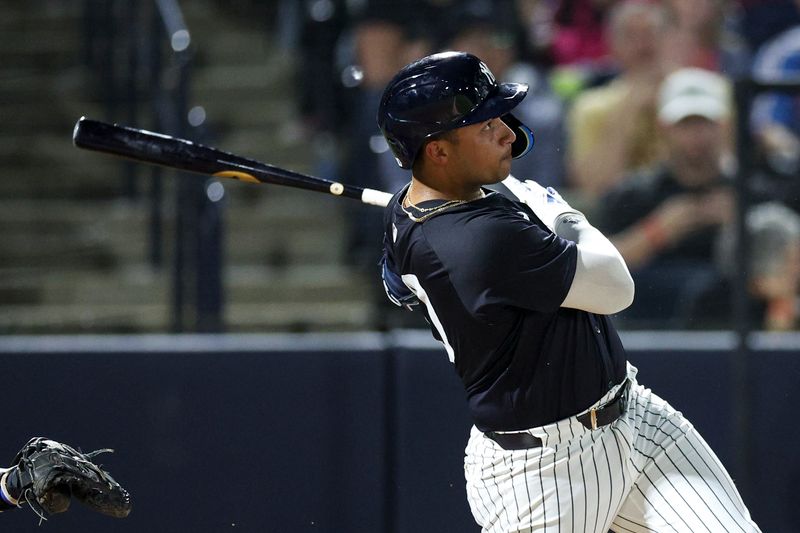 Mar 1, 2024; Tampa, Florida, USA;  New York Yankees left fielder Everson Pereira (80) hits a two-run home run against the Toronto Blue Jays in the second inning at George M. Steinbrenner Field. Mandatory Credit: Nathan Ray Seebeck-USA TODAY Sports