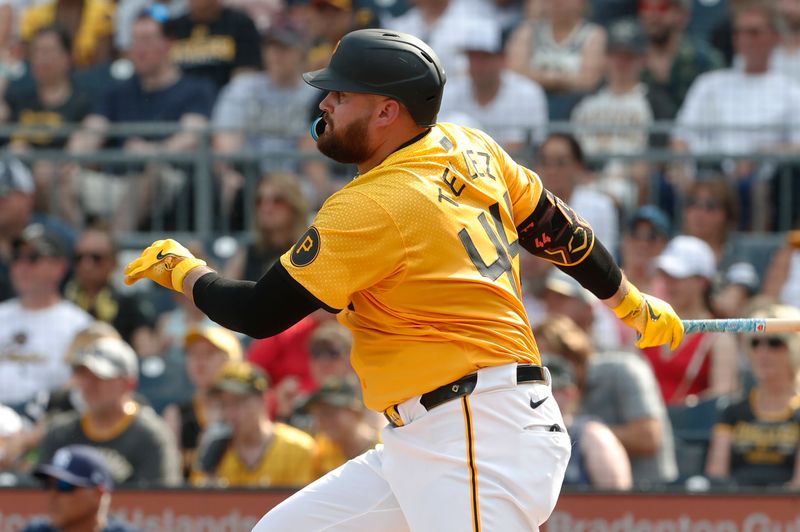 Jun 22, 2024; Pittsburgh, Pennsylvania, USA;  Pittsburgh Pirates first baseman Rowdy Tellez (44) hits an RBI single against the Tampa Bay Rays during the third inning at PNC Park. Mandatory Credit: Charles LeClaire-USA TODAY Sports