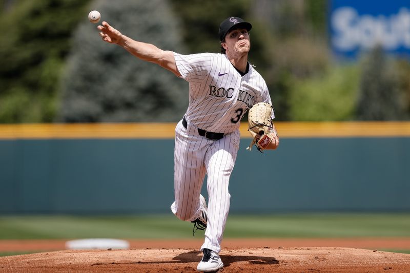Apr 30, 2025; Denver, Colorado, USA; Colorado Rockies starting pitcher Chase Dollander (32) pitches in the first inning against the Atlanta Braves at Coors Field. Mandatory Credit: Isaiah J. Downing-Imagn Images