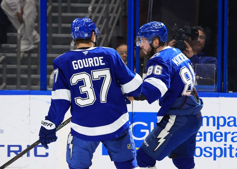 Jan 29, 2026; Tampa, Florida, USA; Tampa Bay Lightning right wing Nikita Kucherov (86) is congratulated  by center Yanni Gourde (37) after he scored a goal against the Winnipeg Jets during the third period at Benchmark International Arena. Mandatory Credit: Kim Klement Neitzel-Imagn Images