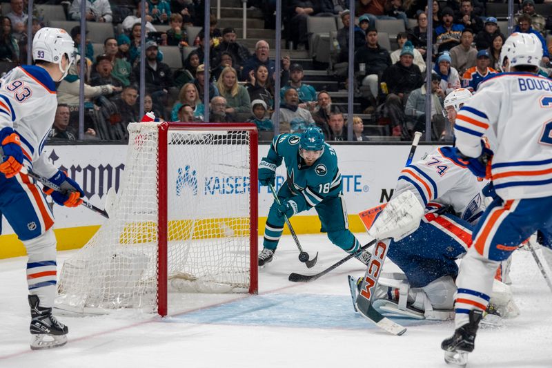 Dec 28, 2023; San Jose, California, USA; San Jose Sharks right wing Filip Zadina (18) passes the puck against the Edmonton Oilers during the second period at SAP Center at San Jose. Mandatory Credit: Neville E. Guard-USA TODAY Sports