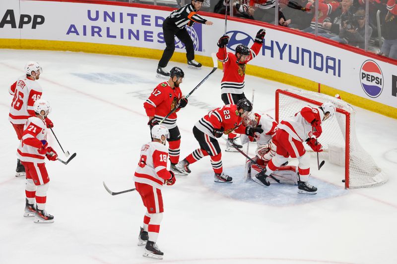 Feb 25, 2024; Chicago, Illinois, USA; Chicago Blackhawks left wing Nick Foligno (17) scores against the Detroit Red Wings during the second period at United Center. Mandatory Credit: Kamil Krzaczynski-USA TODAY Sports