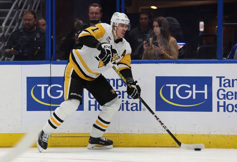 Dec 6, 2023; Tampa, Florida, USA; Pittsburgh Penguins center Evgeni Malkin (71) passes the puck against the Tampa Bay Lightning during the third period at Amalie Arena. Mandatory Credit: Kim Klement Neitzel-USA TODAY Sports