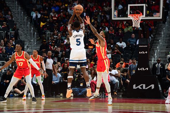 ATLANTA, GA - OCTOBER 30: Anthony Edwards #5 of the Minnesota Timberwolves shoots a three point basket against the Atlanta Hawks on October 30, 2023 at State Farm Arena in Atlanta, Georgia.  NOTE TO USER: User expressly acknowledges and agrees that, by downloading and/or using this Photograph, user is consenting to the terms and conditions of the Getty Images License Agreement. Mandatory Copyright Notice: Copyright 2023 NBAE (Photo by Scott Cunningham/NBAE via Getty Images)