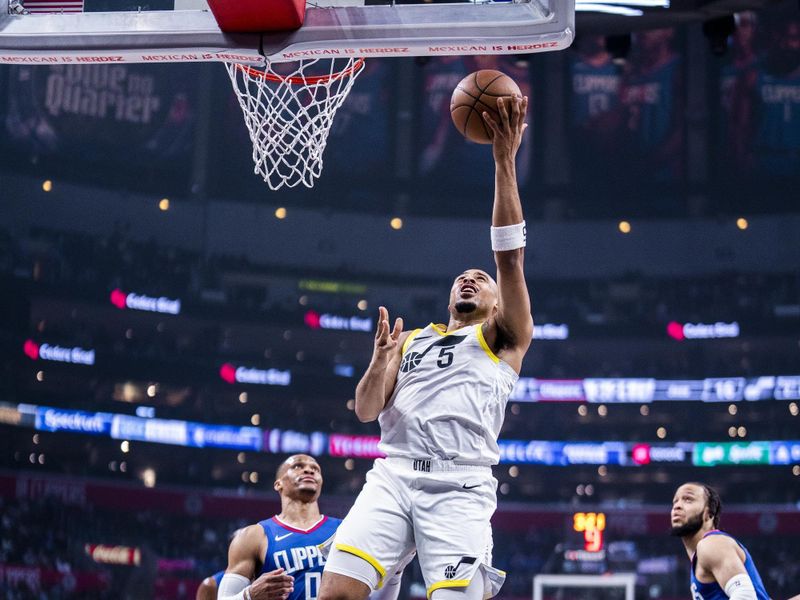 LOS ANGELES, CA - APRIL 12: Talen Horton-Tucker #5 of the Utah Jazz drives to the basket during the game against the LA Clippers on April 12, 2024 at Crypto.Com Arena in Los Angeles, California. NOTE TO USER: User expressly acknowledges and agrees that, by downloading and/or using this Photograph, user is consenting to the terms and conditions of the Getty Images License Agreement. Mandatory Copyright Notice: Copyright 2024 NBAE (Photo by Tyler Ross/NBAE via Getty Images)