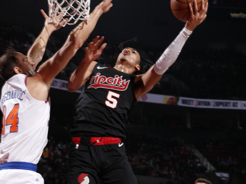 PORTLAND, OR - MARCH 14: Dalano Banton #5 of the Portland Trail Blazers drives to the basket during the game against the New York Knicks on March 14, 2024 at the Moda Center Arena in Portland, Oregon. NOTE TO USER: User expressly acknowledges and agrees that, by downloading and or using this photograph, user is consenting to the terms and conditions of the Getty Images License Agreement. Mandatory Copyright Notice: Copyright 2024 NBAE (Photo by Cameron Browne/NBAE via Getty Images)