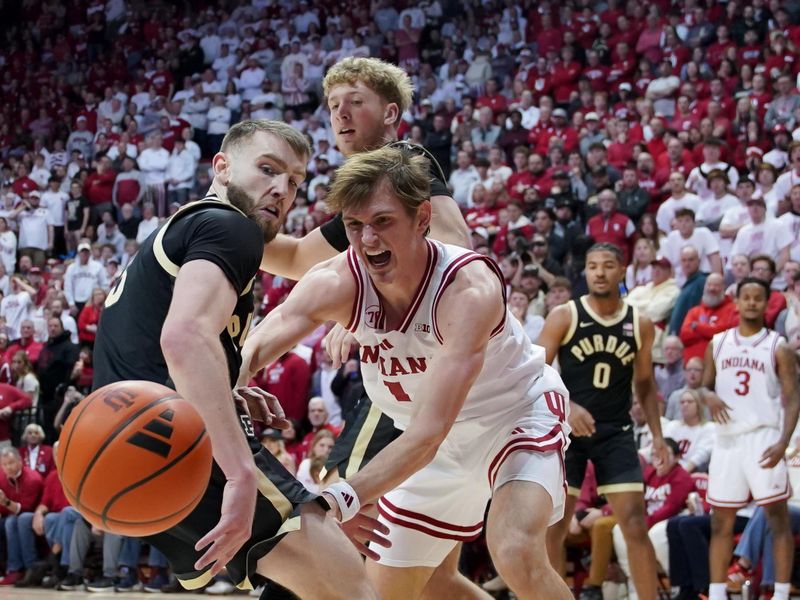 Jan 27, 2026; Bloomington, Indiana, USA; Purdue Boilermakers guard Braden Smith (3) and Indiana Hoosiers forward Reed Bailey (1) go after a loose ball during the first half at Simon Skjodt Assembly Hall. Mandatory Credit: Robert Goddin-Imagn Images