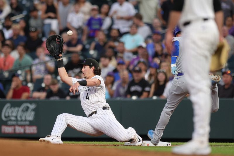 Sep 13, 2024; Denver, Colorado, USA; Colorado Rockies first baseman Michael Toglia (4) is unable to field a throw in the second inning against the Chicago Cubs at Coors Field. Mandatory Credit: Isaiah J. Downing-Imagn Images