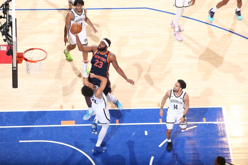 NEW YORK, NY - APRIL 12: Mitchell Robinson #23 of the New York Knicks drives to the basket during the game against the Brooklyn Nets on April 12, 2024 at Madison Square Garden in New York City, New York.  NOTE TO USER: User expressly acknowledges and agrees that, by downloading and or using this photograph, User is consenting to the terms and conditions of the Getty Images License Agreement. Mandatory Copyright Notice: Copyright 2024 NBAE  (Photo by Nathaniel S. Butler/NBAE via Getty Images)