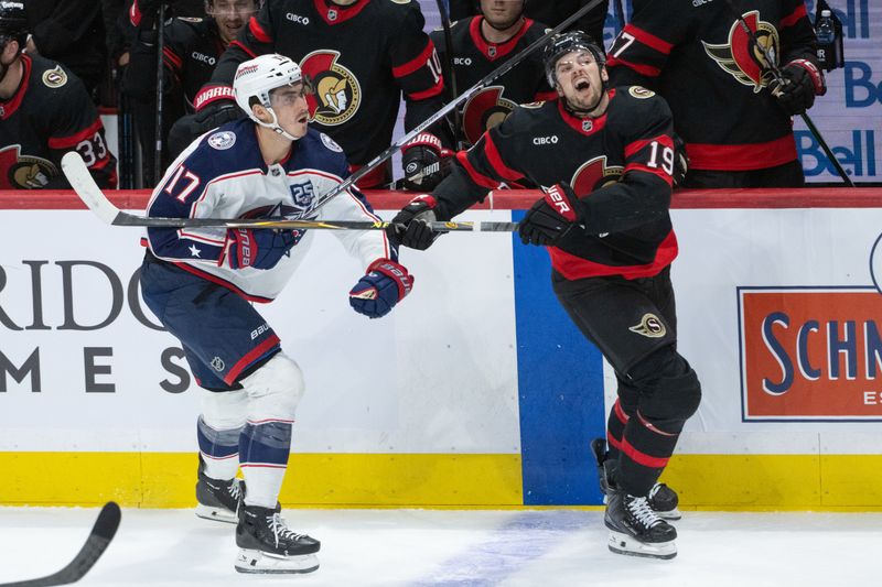 Dec 29, 2025; Ottawa, Ontario, CAN; Columbus Blue Jackets left wing Mason Marchment (17) battles with Ottawa Senators right wing Drake Batherson (19) in the third period at the Canadian Tire Centre. Mandatory Credit: Marc DesRosiers-IMAGN Images