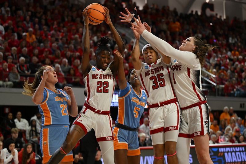 Mar 25, 2024; Raleigh, North Carolina, USA; NC State Wolfpack guard Saniya Rivers (22) grabs a rebound in the second round of the 2024 NCAA Women's Tournament at James T. Valvano Arena at William Neal Reynolds. Mandatory Credit: William Howard-USA TODAY Sports