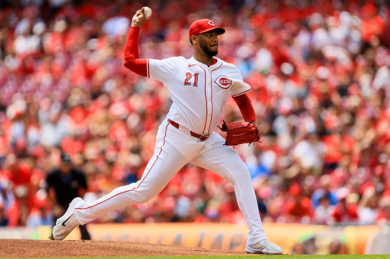 Jul 11, 2024; Cincinnati, Ohio, USA; Cincinnati Reds starting pitcher Hunter Greene (21) pitches against the Colorado Rockies in the first inning at Great American Ball Park. Mandatory Credit: Katie Stratman-USA TODAY Sports