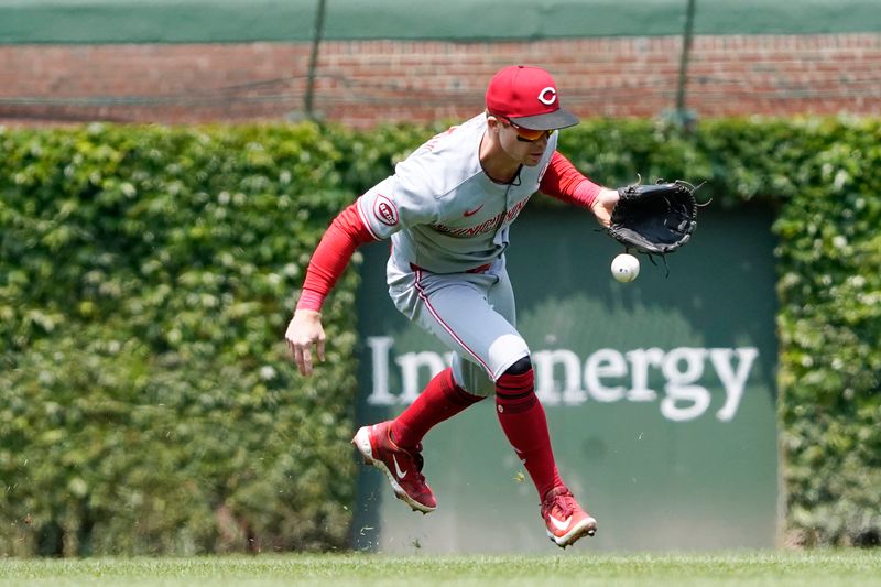 Jun 1, 2025; Chicago, Illinois, USA; Cincinnati Reds second baseman Matt McLain (9) loses the ball in the sun against the Chicago Cubs during the third inning at Wrigley Field. Mandatory Credit: David Banks-Imagn Images