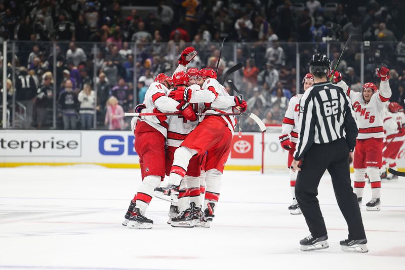 Oct 14, 2023; Los Angeles, California, USA; Carolina Hurricanes Left Wing Jordan Martinook (48) celebrates with his teammates after a shootout at Crypto.com Arena. Mandatory Credit: Yannick Peterhans-USA TODAY Sports