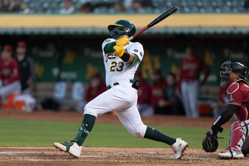 May 16, 2023; Oakland, California, USA; Oakland Athletics catcher Shea Langeliers (23) hits a double during the fourth inning against the Arizona Diamondbacks at Oakland-Alameda County Coliseum. Mandatory Credit: Stan Szeto-USA TODAY Sports