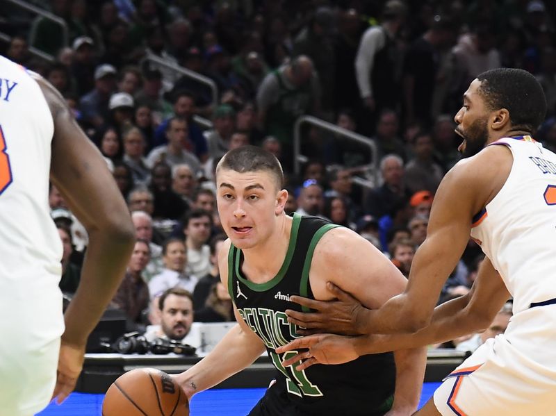 BOSTON, MA - MAY 14: Payton Pritchard #11 of the Boston Celtics drives to the basket during the game against the New York Knicks during Round Two Game Five of the 2025 NBA Playoffs on May 14, 2025 at TD Garden in Boston, Massachusetts. NOTE TO USER: User expressly acknowledges and agrees that, by downloading and/or using this Photograph, user is consenting to the terms and conditions of the Getty Images License Agreement. Mandatory Copyright Notice: Copyright 2025 NBAE (Photo by Brian Babineau/NBAE via Getty Images)