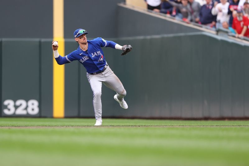 Oct 4, 2023; Minneapolis, Minnesota, USA; Toronto Blue Jays second baseman Cavan Biggio (8) throws the ball to first in the fourth inning against the Minnesota Twins during game two of the Wildcard series for the 2023 MLB playoffs at Target Field. Mandatory Credit: Jesse Johnson-USA TODAY Sports