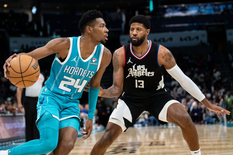 CHARLOTTE, NORTH CAROLINA - MARCH 31: Paul George #13 of the LA Clippers guards Brandon Miller #24 of the Charlotte Hornets during their game at Spectrum Center on March 31, 2024 in Charlotte, North Carolina. NOTE TO USER: User expressly acknowledges and agrees that, by downloading and or using this photograph, User is consenting to the terms and conditions of the Getty Images License Agreement. (Photo by Jacob Kupferman/Getty Images)