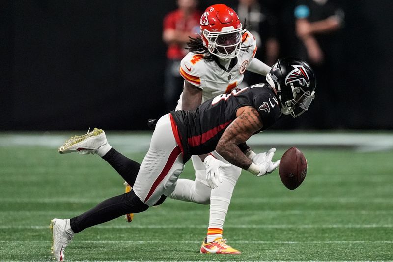 Atlanta Falcons safety Jessie Bates III (3) breaks up a pass intended for Kansas City Chiefs wide receiver Rashee Rice (4) during the first half of an NFL football game, Sunday, Sept. 22, 2024, in Atlanta. (AP Photo/John Bazemore)