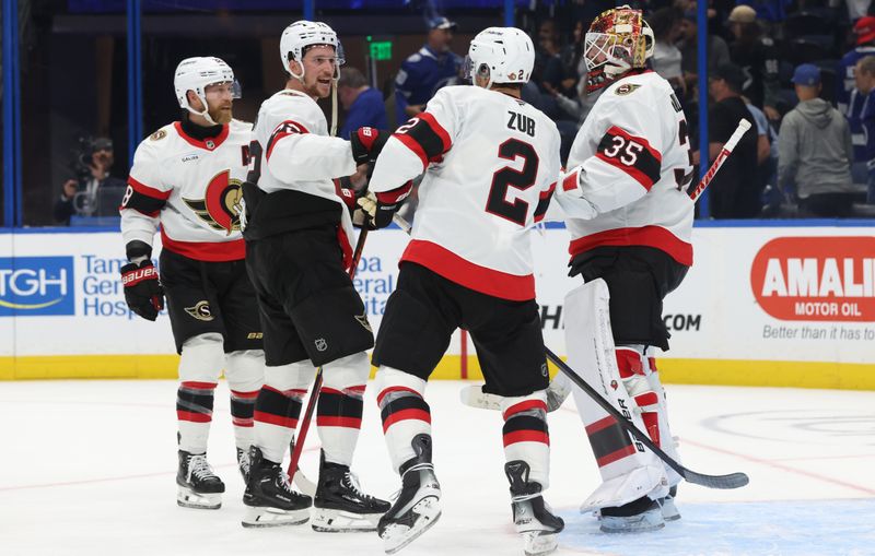 Oct 9, 2025; Tampa, Florida, USA; Ottawa Senators defenseman Thomas Chabot (72), defenseman Artem Zub (2) and goaltender Linus Ullmark (35) celebrates  after they  beat the Tampa Bay Lightning at Benchmark International Arena. Mandatory Credit: Kim Klement Neitzel-Imagn Images