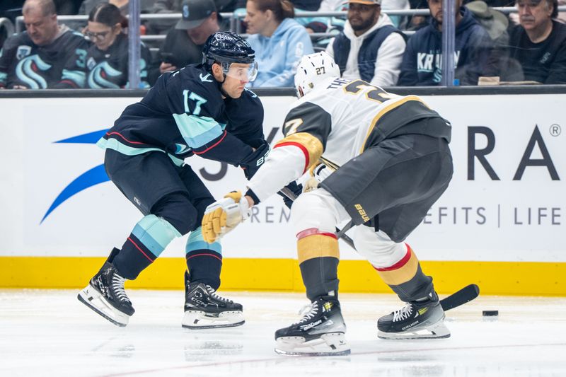 Oct 11, 2025; Seattle, Washington, USA; Seattle Kraken forward Jaden Schwartz (17) skates with the puck against Vegas Golden Knights defenseman Shea Theodore (27) during the second period at Climate Pledge Arena. Mandatory Credit: Stephen Brashear-Imagn Images