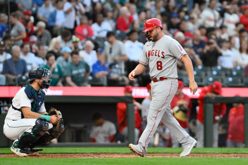 Sep 11, 2023; Seattle, Washington, USA; Los Angeles Angels designated hitter Mike Moustakas (8) scores a run on a two-run home run hit by catcher Logan O'Hoppe (not pictured) during the second inning against the Seattle Mariners at T-Mobile Park. Mandatory Credit: Steven Bisig-USA TODAY Sports