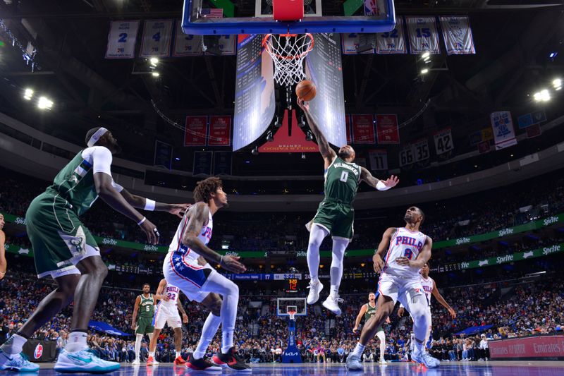 PHILADELPHIA, PA - FEBRUARY 25: Damian Lillard #0 of the Milwaukee Bucks drives to the basket during the game against the Philadelphia 76ers on February 25, 2024 at the Wells Fargo Center in Philadelphia, Pennsylvania NOTE TO USER: User expressly acknowledges and agrees that, by downloading and/or using this Photograph, user is consenting to the terms and conditions of the Getty Images License Agreement. Mandatory Copyright Notice: Copyright 2024 NBAE (Photo by Jesse D. Garrabrant/NBAE via Getty Images)