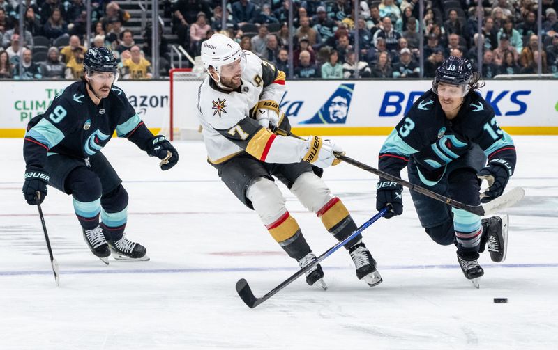 Nov 8, 2024; Seattle, Washington, USA;  Vegas Golden Knightsdefenseman Alex Pietrangelo (7) passes the puck against Seattle Kraken forward Chandler Stephenson (9) and forward Brandon Tanev (13) during the first period at Climate Pledge Arena. Mandatory Credit: Stephen Brashear-Imagn Images