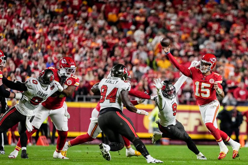 Kansas City Chiefs quarterback Patrick Mahomes (15) passes the ball against the Tampa Bay Buccaneers during the first half of an NFL football game, Monday, Nov. 4, 2024, in Kansas City, Mo. (AP Photo/Ed Zurga)