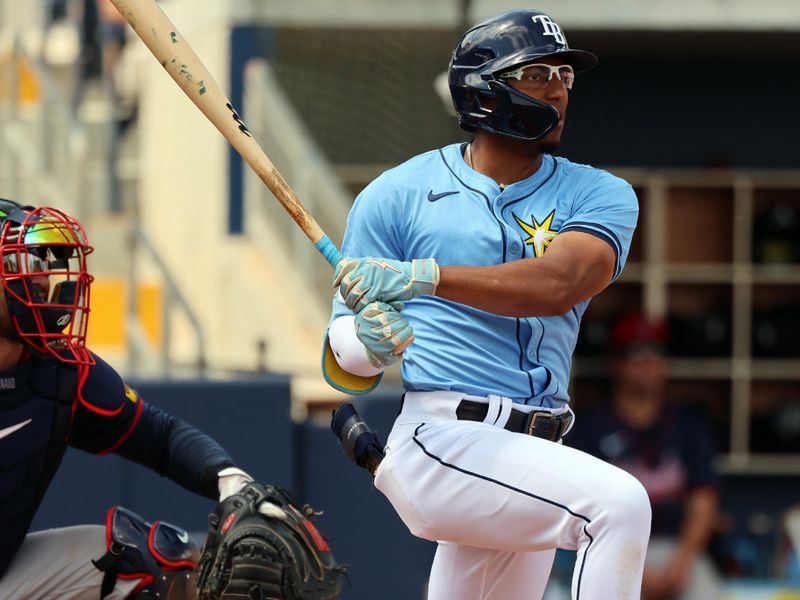 Mar 18, 2024; Port Charlotte, Florida, USA; Tampa Bay Rays outfielder Richie Palacios (1) singles during the fifth inning against the Atlanta Braves at Charlotte Sports Park. Mandatory Credit: Kim Klement Neitzel-USA TODAY Sports