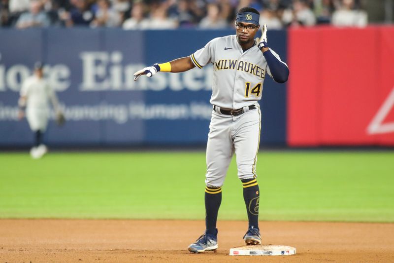 Sep 8, 2023; Bronx, New York, USA;  Milwaukee Brewers third baseman Andruw Monasterio (14) gestures after hitting a double in the seventh inning against the New York Yankees at Yankee Stadium. Mandatory Credit: Wendell Cruz-USA TODAY Sports