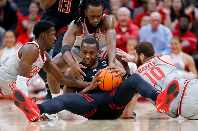 Jan 3, 2024; Columbus, Ohio, USA; Rutgers Scarlet Knights forward Mawot Mag (center) fights for the loose ball with Ohio State Buckeyes guard Scotty Middleton (left) and Ohio State Buckeyes guard Bruce Thornton (2) and Ohio State Buckeyes forward Jamison Battle (10) during the second half at Value City Arena. Mandatory Credit: Joseph Maiorana-USA TODAY Sports