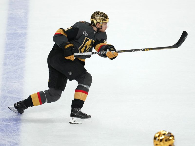 Jan 19, 2023; Las Vegas, Nevada, USA; Vegas Golden Knights center William Karlsson (71) shoots against the Detroit Red Wings during the third period at T-Mobile Arena. Mandatory Credit: Stephen R. Sylvanie-USA TODAY Sports