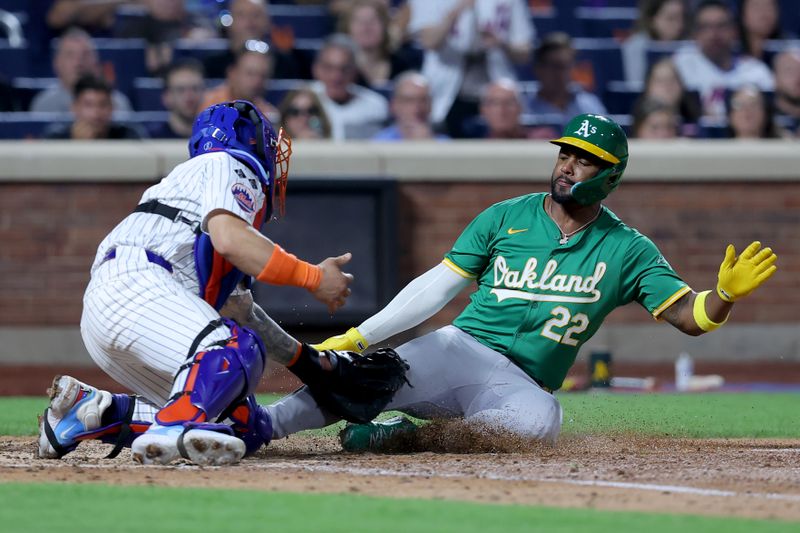 Aug 13, 2024; New York City, New York, USA; Oakland Athletics left fielder Miguel Andujar (22) is tagged out at home by New York Mets catcher Francisco Alvarez (4) trying to score on an infield single by Athletics third baseman Darell Hernaiz (not pictured) during the fifth inning at Citi Field. Mandatory Credit: Brad Penner-USA TODAY Sports