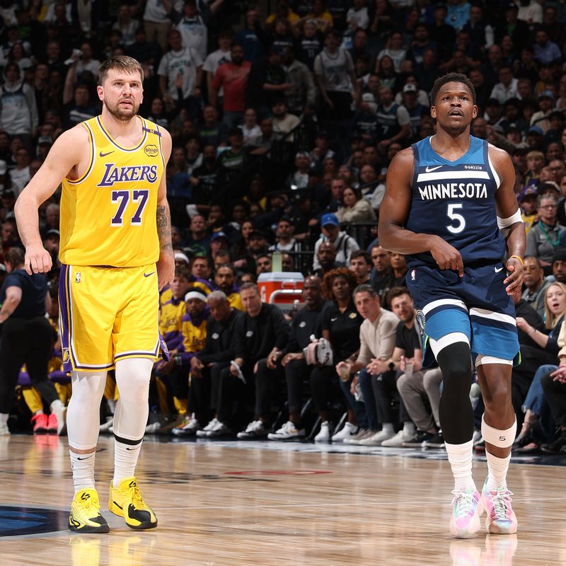 MINNEAPOLIS, MN -  APRIL 25:  Luka Doncic #77 of the Los Angeles Lakers and Anthony Edwards #5 of the Minnesota Timberwolves look on during the game    during Round 1 Game 3 of the 2025 NBA Playoffs  on April 25, 2025 at Target Center in Minneapolis, Minnesota. NOTE TO USER: User expressly acknowledges and agrees that, by downloading and or using this Photograph, user is consenting to the terms and conditions of the Getty Images License Agreement. Mandatory Copyright Notice: Copyright 2025 NBAE (Photo by David Sherman/NBAE via Getty Images)