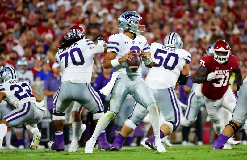 Sep 24, 2022; Norman, Oklahoma, USA;  Kansas State Wildcats quarterback Adrian Martinez (9) throws during the first half against the Oklahoma Sooners at Gaylord Family-Oklahoma Memorial Stadium. Mandatory Credit: Kevin Jairaj-USA TODAY Sports