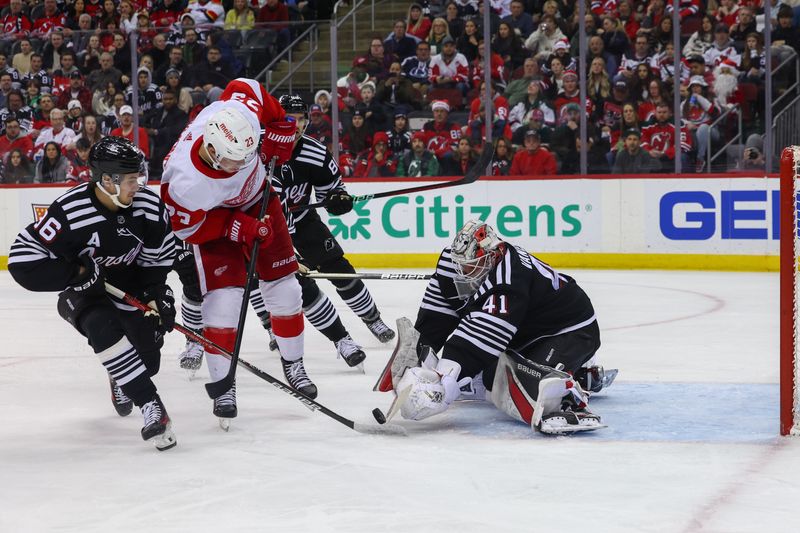 Dec 23, 2023; Newark, New Jersey, USA; New Jersey Devils goaltender Vitek Vanecek (41) makes a save against the Detroit Red Wings during the first period at Prudential Center. Mandatory Credit: Ed Mulholland-USA TODAY Sports