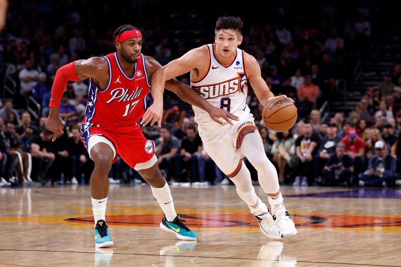 PHOENIX, ARIZONA - MARCH 20: Grayson Allen #8 of the Phoenix Suns drives past Buddy Hield #17 of the Philadelphia 76ers during the second half at Footprint Center on March 20, 2024 in Phoenix, Arizona. NOTE TO USER: User expressly acknowledges and agrees that, by downloading and or using this photograph, User is consenting to the terms and conditions of the Getty Images License Agreement.  (Photo by Chris Coduto/Getty Images)