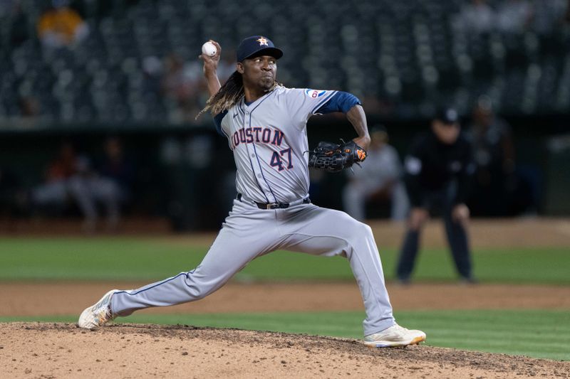 Jul 23, 2024; Oakland, California, USA;  Houston Astros pitcher Rafael Montero (47) pitches during the eighth inning against the Oakland Athletics at Oakland-Alameda County Coliseum. Mandatory Credit: Stan Szeto-USA TODAY Sports