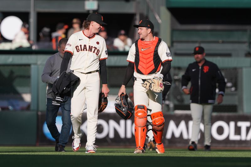 Jun 26, 2024; San Francisco, California, USA; San Francisco Giants starting pitcher Hayden Birdsong (left) and catcher Patrick Bailey (right) talk before the game against the Chicago Cubs at Oracle Park. Mandatory Credit: Darren Yamashita-USA TODAY Sports