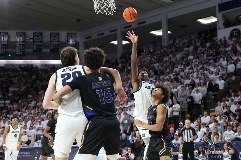 Jan 30, 2024; Logan, Utah, USA; Utah State Aggies forward Great Osobor (1) shoots over San Jose State Spartans forward Christian Wise (20) during the second half at Dee Glen Smith Spectrum. Mandatory Credit: Rob Gray-USA TODAY Sports