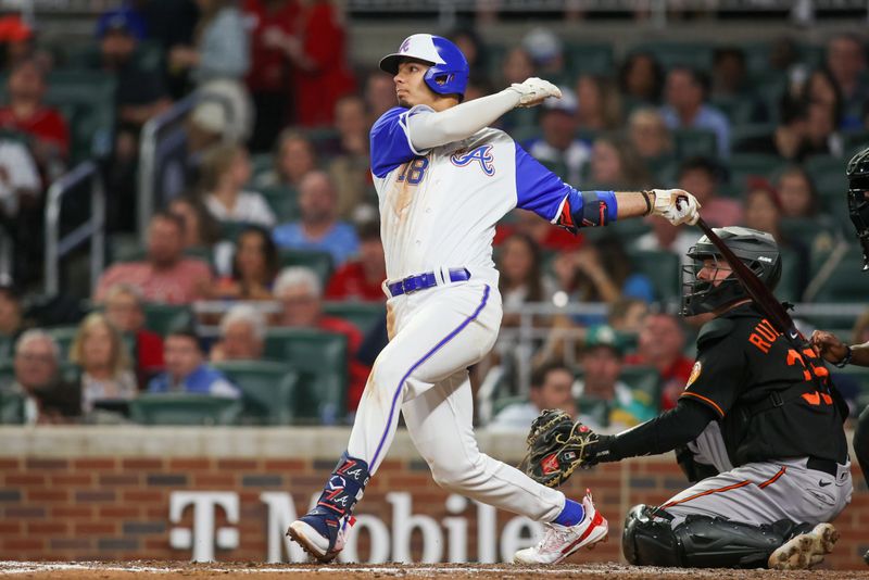 May 6, 2023; Atlanta, Georgia, USA; Atlanta Braves shortstop Vaughn Grissom (18) hits a single against the Baltimore Orioles in the seventh inning at Truist Park. Mandatory Credit: Brett Davis-USA TODAY Sports
