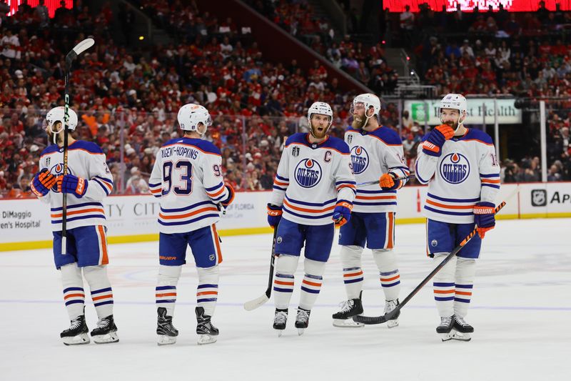 Jun 24, 2024; Sunrise, Florida, USA; Edmonton Oilers forward Connor McDavid (97) and forward Ryan Nugent-Hopkins (93) and forward Zach Hyman (18) await the face off against the Florida Panthers during the first period in game seven of the 2024 Stanley Cup Final at Amerant Bank Arena. Mandatory Credit: Sam Navarro-USA TODAY Sports