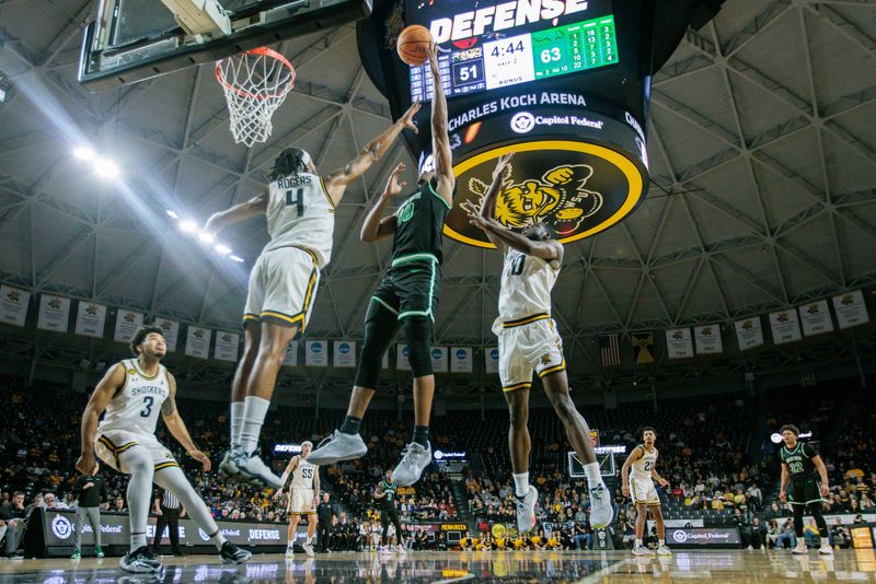 Jan 4, 2024; Wichita, Kansas, USA; North Texas Mean Green forward Robert Allen (10) puts up a shot over Wichita State Shockers guard Colby Rogers (4) during the second half at Charles Koch Arena. Mandatory Credit: William Purnell-USA TODAY Sports