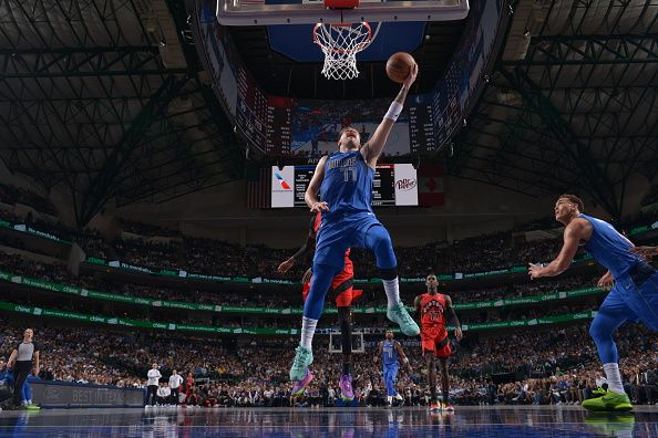 DALLAS, TX - NOVEMBER 8: Luka Doncic #77 of the Dallas Mavericks drives to the basket during the game against the Toronto Raptors on November 8, 2023 at the American Airlines Center in Dallas, Texas. NOTE TO USER: User expressly acknowledges and agrees that, by downloading and or using this photograph, User is consenting to the terms and conditions of the Getty Images License Agreement. Mandatory Copyright Notice: Copyright 2023 NBAE (Photo by Glenn James/NBAE via Getty Images)