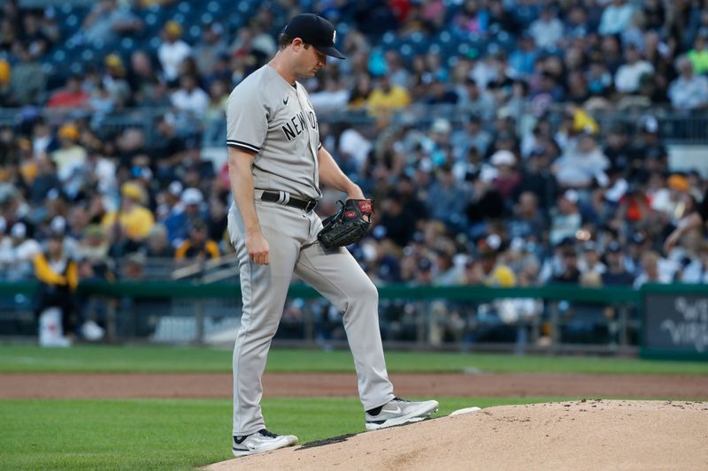 Sep 15, 2023; Pittsburgh, Pennsylvania, USA;  New York Yankees starting pitcher Gerrit Cole (45) composes himself on the back of the mound against the Pittsburgh Pirates during the first inning at PNC Park. Mandatory Credit: Charles LeClaire-USA TODAY Sports