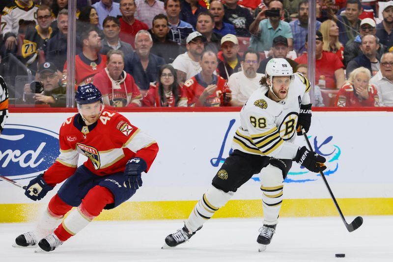 May 14, 2024; Sunrise, Florida, USA; Boston Bruins right wing David Pastrnak (88) moves the puck against the Florida Panthers during the first period in game five of the second round of the 2024 Stanley Cup Playoffs at Amerant Bank Arena. Mandatory Credit: Sam Navarro-USA TODAY Sports