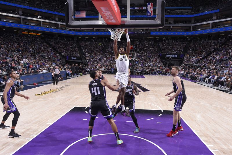 SACRAMENTO, CA - MARCH 31: Kris Dunn #11 of the Utah Jazz drives to the basket during the game against the Sacramento Kings on March 31, 2024 at Golden 1 Center in Sacramento, California. NOTE TO USER: User expressly acknowledges and agrees that, by downloading and or using this Photograph, user is consenting to the terms and conditions of the Getty Images License Agreement. Mandatory Copyright Notice: Copyright 2024 NBAE (Photo by Rocky Widner/NBAE via Getty Images)